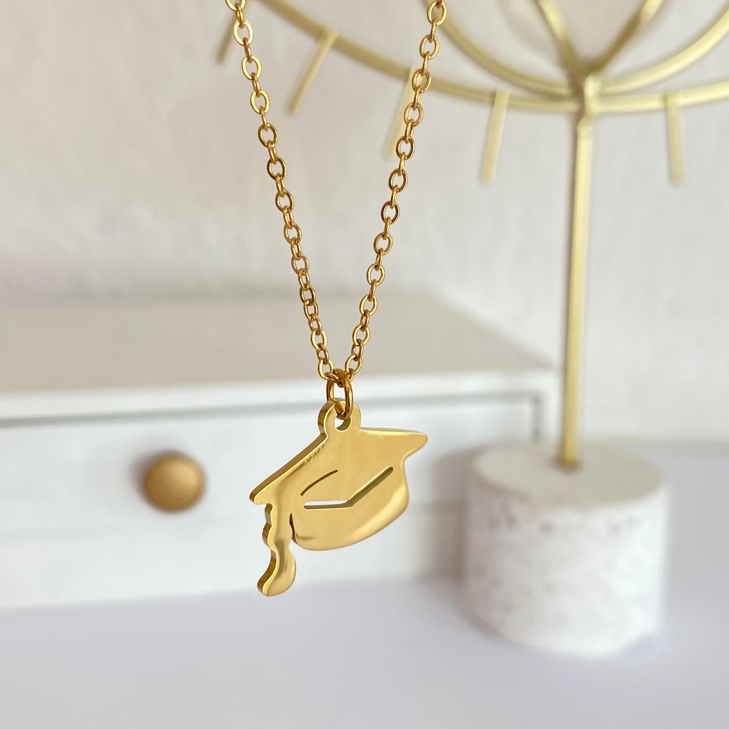 Collar birrete dorado acero