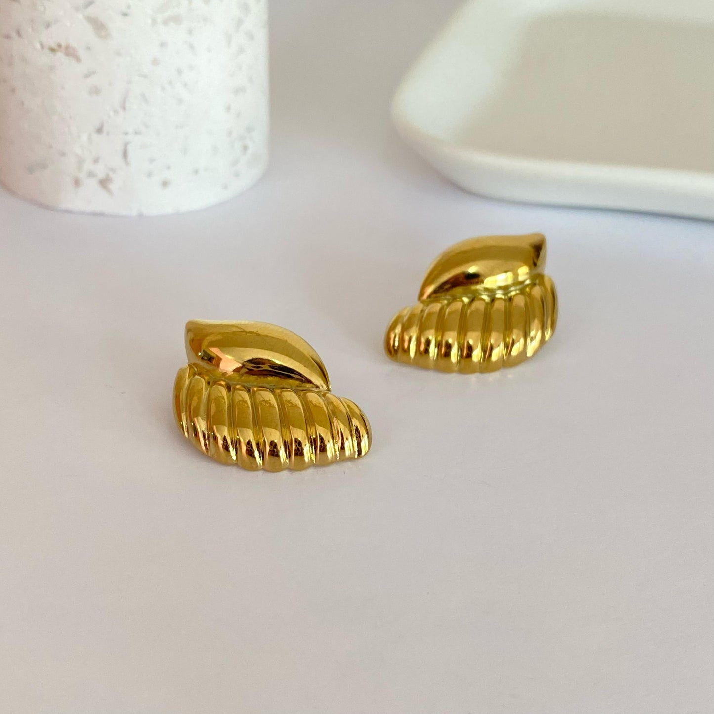Aretes alas acero